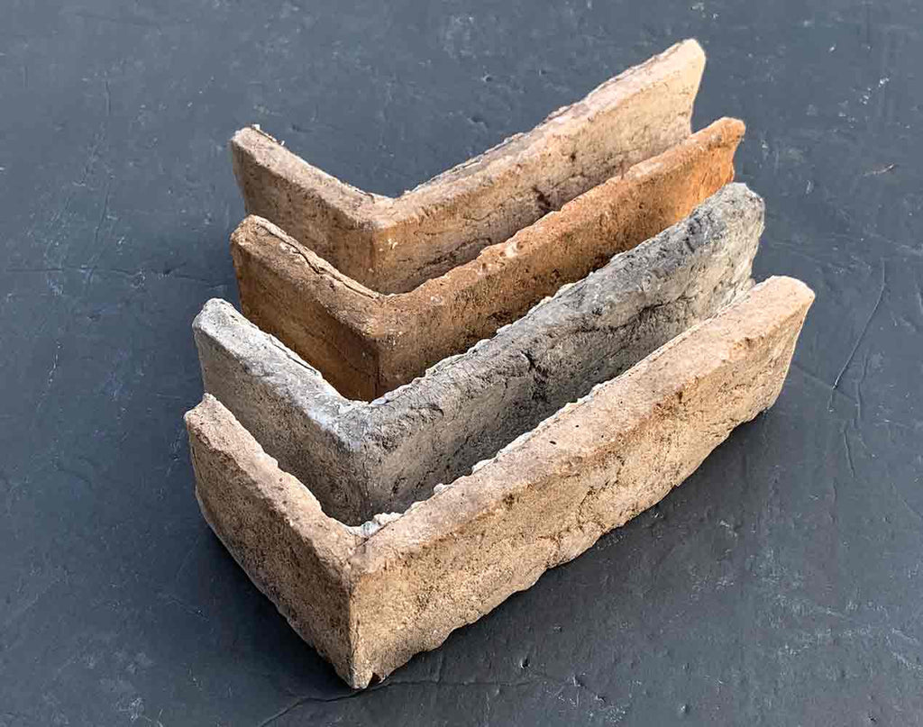 Renewed Antique Brick 2918. Warm Tan and Cream Thin Brick Veneer. 1/2″ Thickness. Weathered Surface with Gray Patina and Orange Highlights.