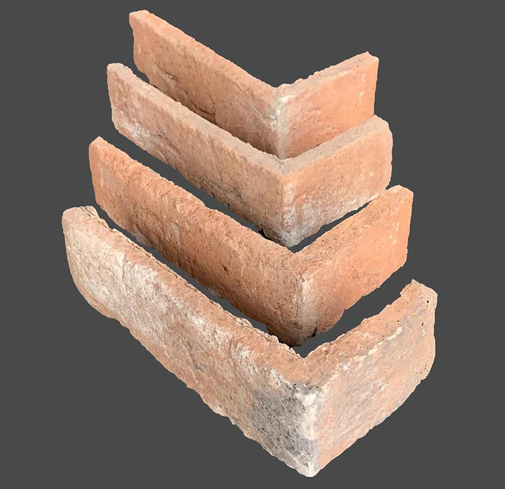 Renewed Antique Brick 2920. Aged Orange and Peach Thin Brick Veneer. 1/2″ Thickness. Copper Tones with Lime, Black, and Gray Stains for a Timeworn Finish.