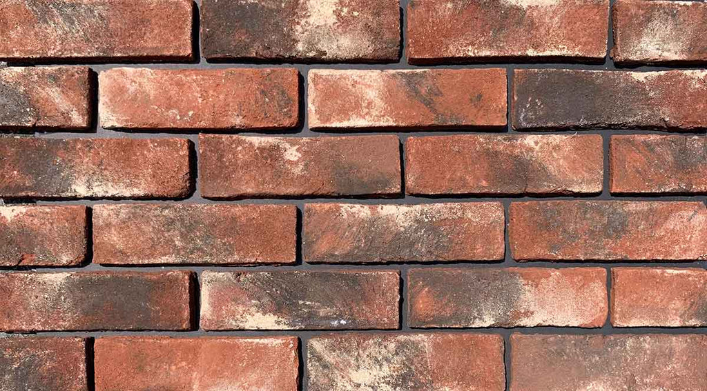 Modular Stained Thin Brick Veneer. Weathered Patina with Deep Terracotta tones &amp; black and white shades on the surface. 1/2″ in Thickness.