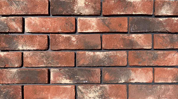 Modular Stained Thin Brick Veneer. Weathered Patina with Deep Terracotta tones &amp; black and white shades on the surface. 1/2″ in Thickness.