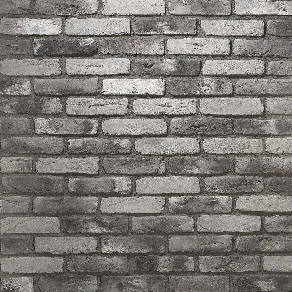 Renewed Antique Brick 2919. Thin Brick Veneer in Varying Shades of Gray. Time-Weathered Surface with Distressed Corners. Half-Inch in Thickness.