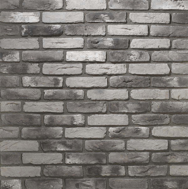 Renewed Antique Brick 2919. Thin Brick Veneer in Varying Shades of Gray. Time-Weathered Surface with Distressed Corners. Half-Inch in Thickness.