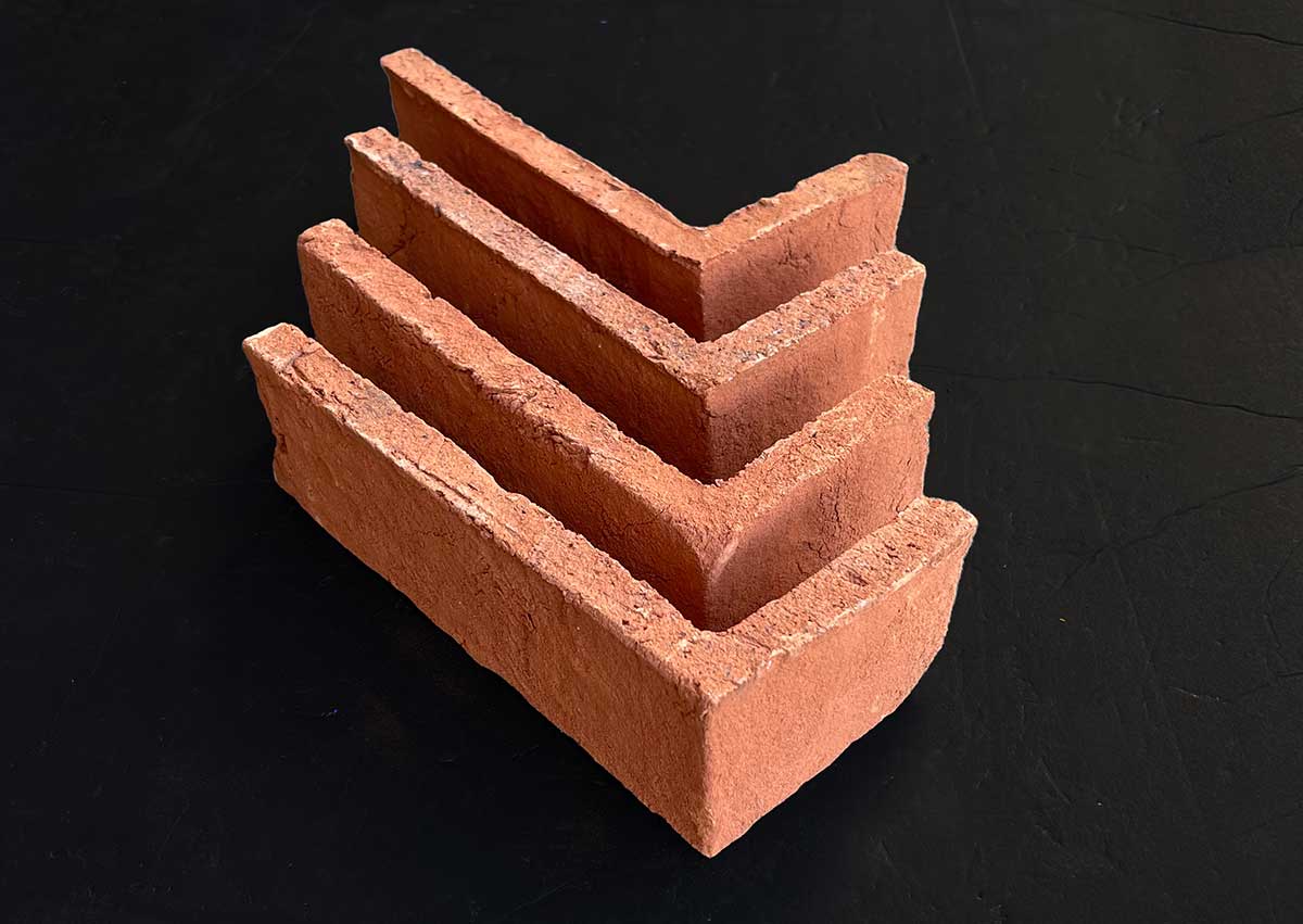Modular Orange Thin Brick Veneer. Hand Made. 1/2″ Thickness. Weathered Orange Hue with Authentic, Artisan Craftsmanship.