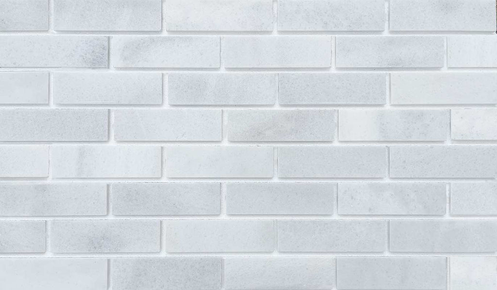 Marble Brick - White. Elegant Finish with Subtle Veining and Defined Corners. Thin Brick Veneer Sliced from Real Marble.