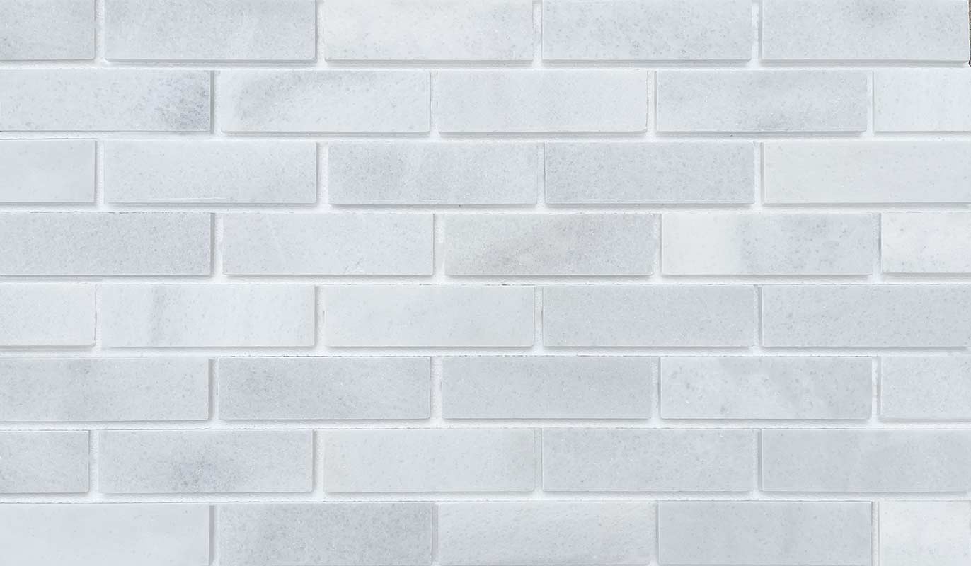 Marble Brick - White. Elegant Finish with Subtle Veining and Defined Corners. Thin Brick Veneer Sliced from Real Marble.