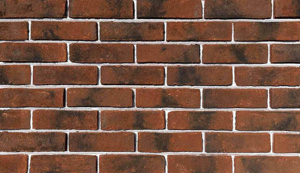 Bordeaux Modular Thin Brick Veneer. Deep Terracotta Background with Black Shades on Surface. Rough-Textured Finish with Vintage Character.