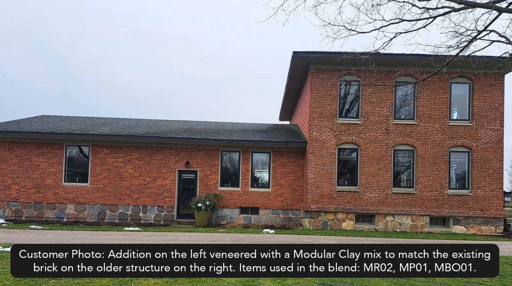 Bordeaux Modular Thin Brick Veneer. Deep Terracotta Background with Black Shades on Surface. Rough-Textured Finish with Vintage Character.